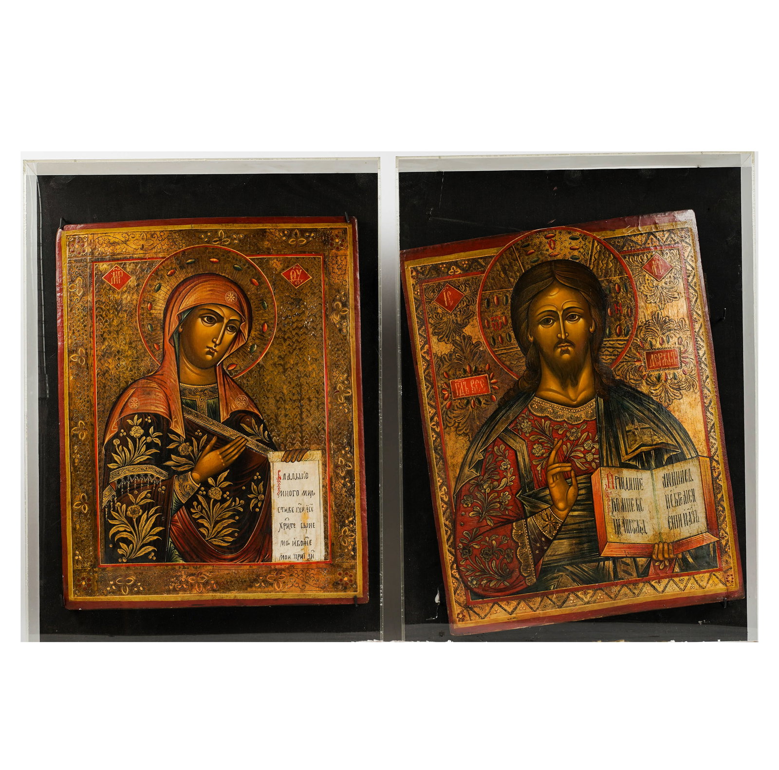 Two Russian Icons: in acyrlic cases each: 17 1/2 x 13 1/2 in. (44.5 x 34.3 cm.), Frame: 21 3/4 x 15 3/4 in. (55.2 x 40 cm.)