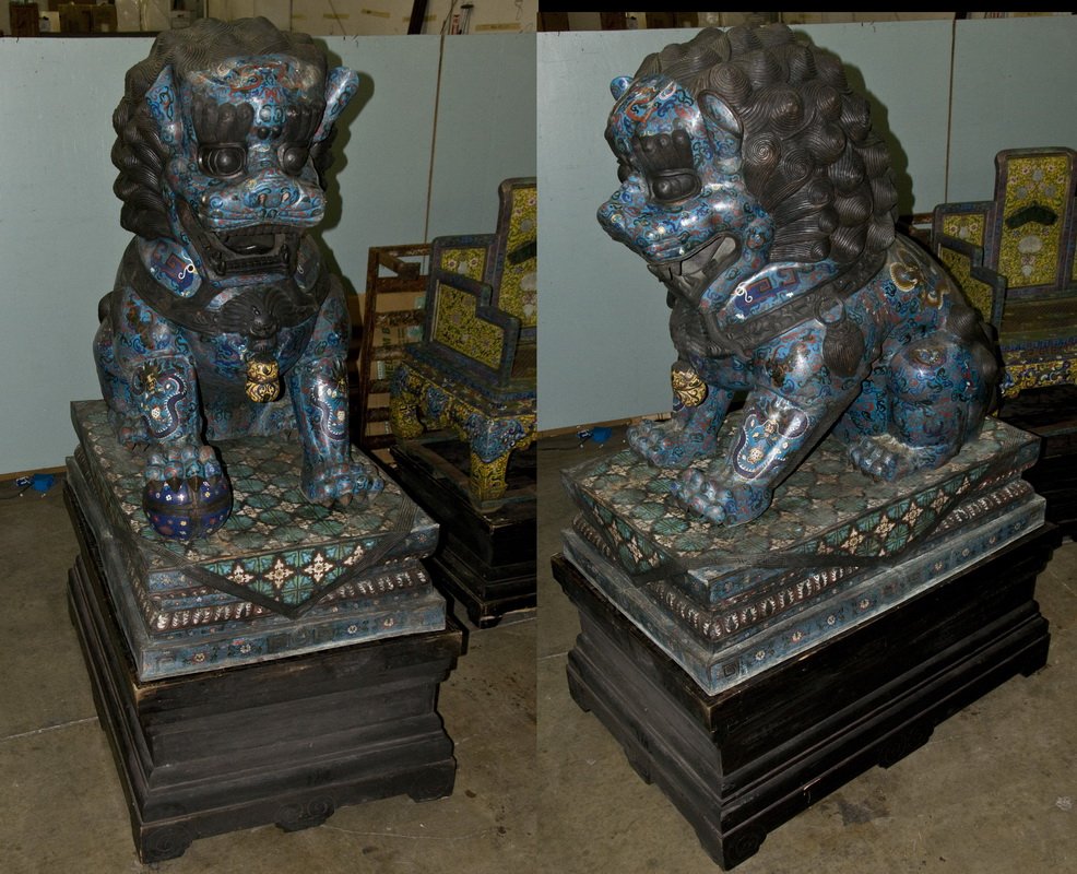PAIR OF CHINESE CLOISONNE PALATIAL FOO LIONS ON STANDS: on tiered cloisonne and wooden stands 35 inches wide; 53 1/2 inches deep; 86 1/2 inches high