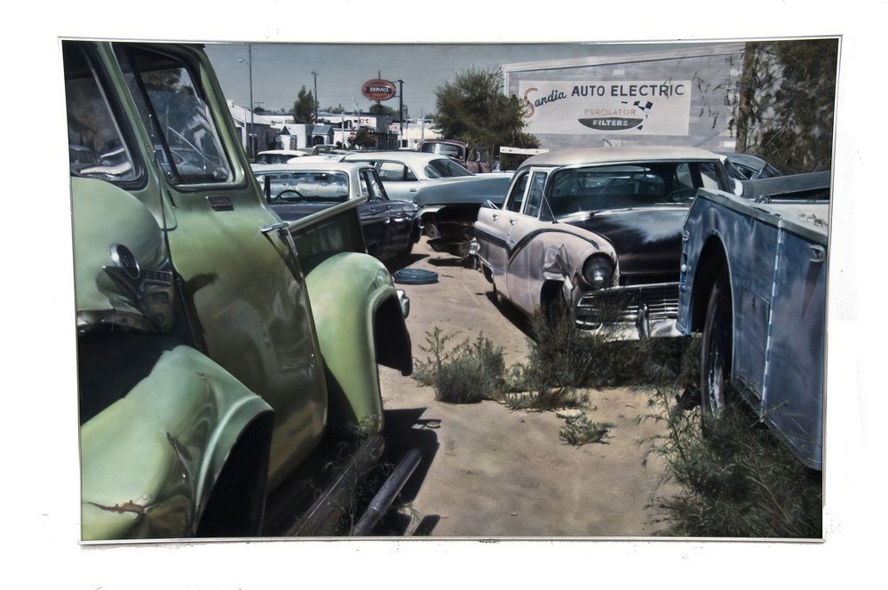 JOHN SALT: "ALBUQUERQUE WRECK YARD": JOHN SALT: "ALBUQUERQUE WRECK YARD (SANDIA AUTO ELECTRIC)" circa 1972 oil on canvas signed and date verso Provenance: O.K. Harris Works of Art, New York Galerie Arditti, Paris Sotheby's-- New York, No