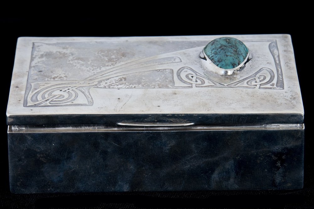 EDWARDIAN ART NOUVEAU SILVER & TURQUOISE BOX: Birmingham, 1906-07 with a cabochon stone and wood liner Provenance: Estate of David Copley, La Jolla 5 1/2 inches long