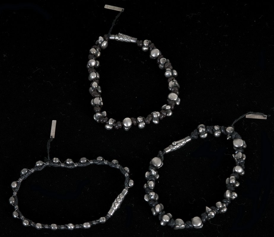 THREE BOTTEGA VENETA LEATHER & SILVER BRACELETS: each bracelet with silver beads with intrecciato woven leather; oxidized silver closure; engraved logo each measuring 8 1/2 inches long