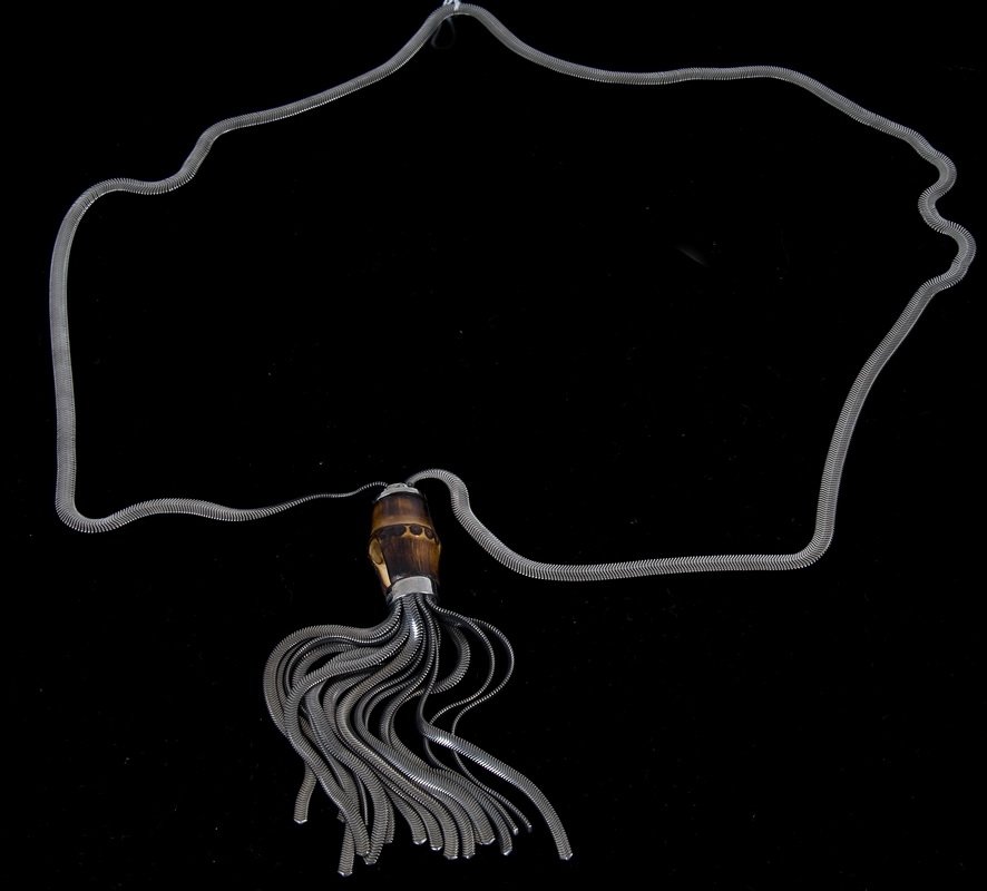 GUCCI BAMBOO AND METAL TASSLE NECKLACE: sterling silver herringbone chain; bamboo ornament and silver tassel; signed "Gucci" 26 inches long