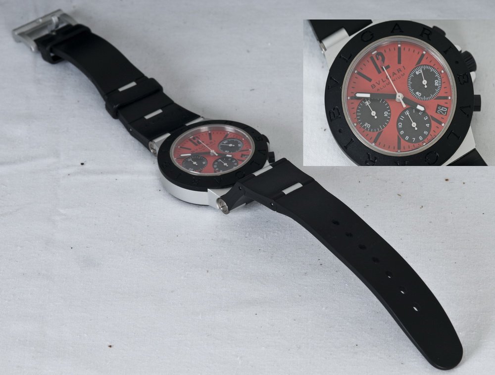 BVLGARI ALUMINUM CHRONOGRAPH WRISTWATCH: Diagono model; rubber strap; aluminum Bvlgari buckle; red dial with black sub-dials; sapphire crystal 1 1/2 inches diameter