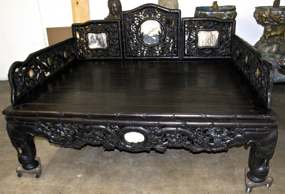 CHINESE CARVED ZITAN HARDWOOD OPIUM BED: the pierced back, arms, and apron with marble inserts 79 inches wide; 62 inches deep; 51 inches high