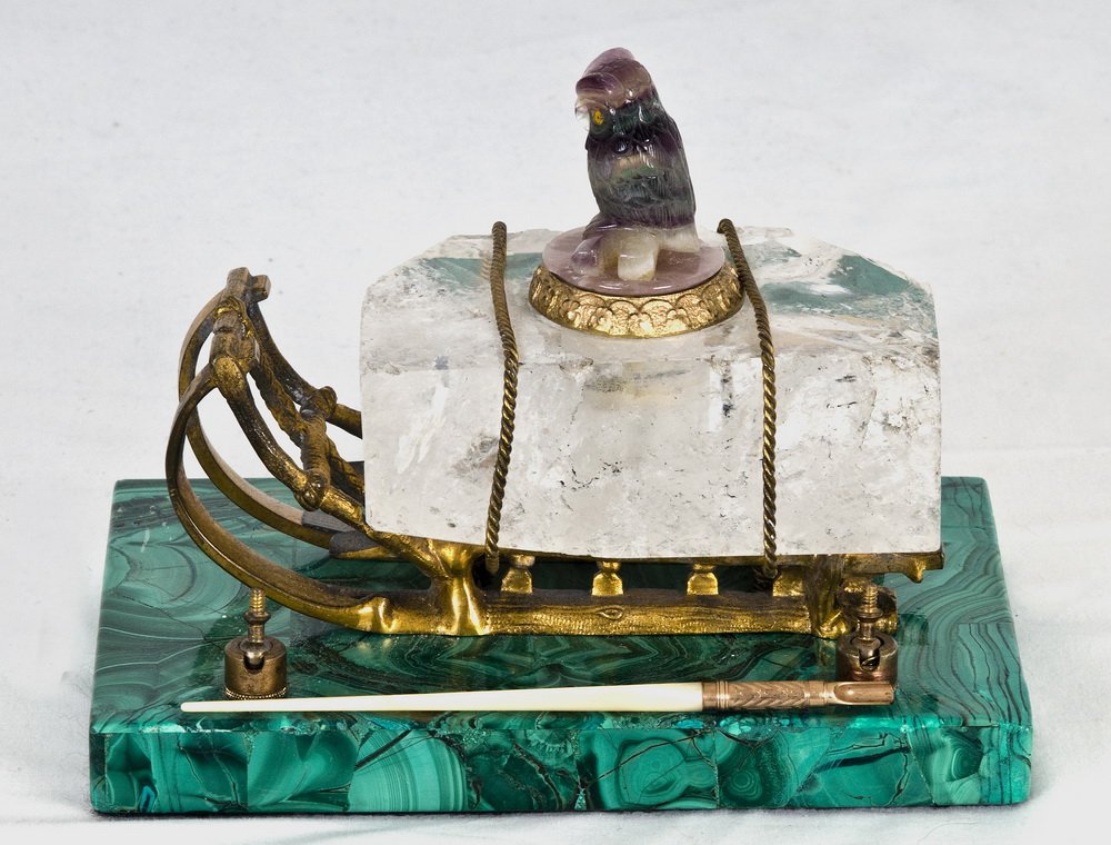 CONTINENTAL ROCK CRYSTAL, GILT BRONZE & MALCHITE: the carved amethyst owl finial atop a sled-form base and malachite plinth; together with a quill with a plaque on rail from Nicholas Haydon, New York 7 1/2 inches wide; 5 inches deep; 5 1/2 inches hig