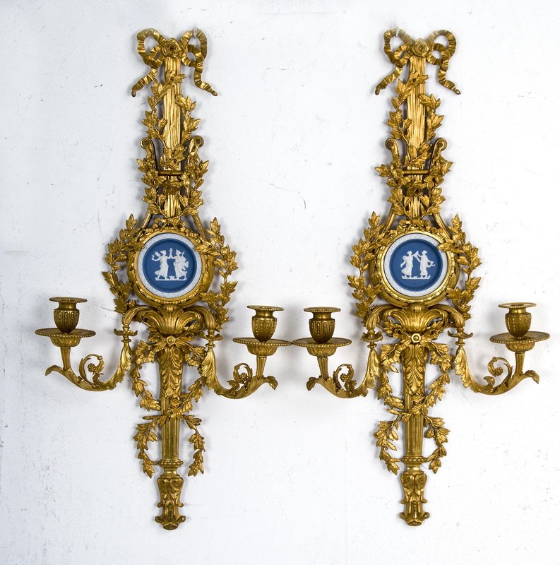 PAIR OF LOUIS XVI STYLE DORE BRONZE TWO-LIGHT SCONCES: each having a foliate and ribbon design surrounding a small central Wedgwood plaque featuring two classical figures, below which extend two arms 28 inches long