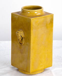 CHINESE YELLOW PORCELAIN KONG VASE: the yellow glazed square body with applied elephant form masques Provenance: The Estate of Dr. Herbert & Mrs. Rita LeRoy Roedling, a William "Billy" Haines commission 11 1/4 inches high