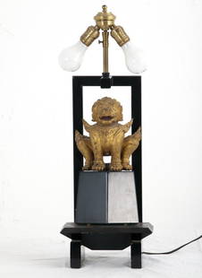 WILLIAM "BILLY" HAINES: THAI GILT WOOD DEITY TABLE LAMP: on a black lacquered Haines designed mount; no shade Provenance: Property of Anita May Rosenstein 25 inches high