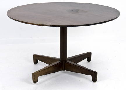 WILLIAM "BILLY" HAINES: WALNUT OCCASIONAL TABLE: the circular top above four stylized supports Provenance: The Estate of Dr. Herbert & Mrs. Rita LeRoy Roedling, a William "Billy" Haines commission 36 inches diameter; 21 inches high