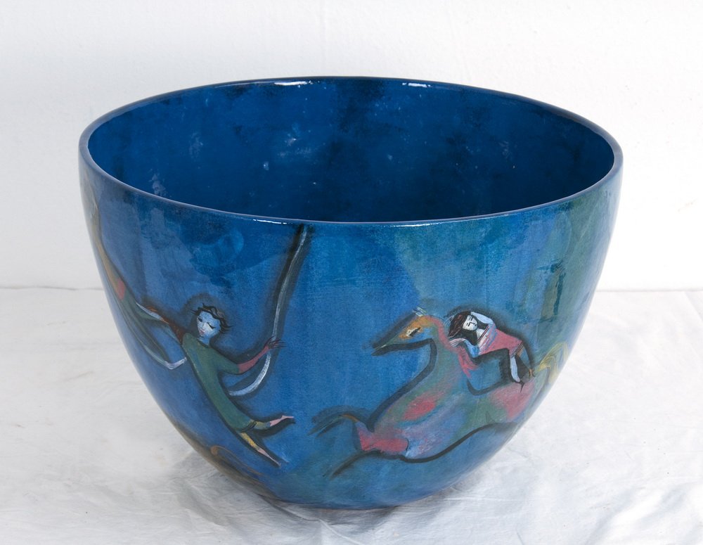 POLIA PILLIN: CERAMIC PLANTER: the blue glazed ground decorated with underglaze imagery of dancing figures and horses signed bottom Provenance: The Estate of Sidney & Diana Avery 15 1/2 inches diameter; 11 inches high