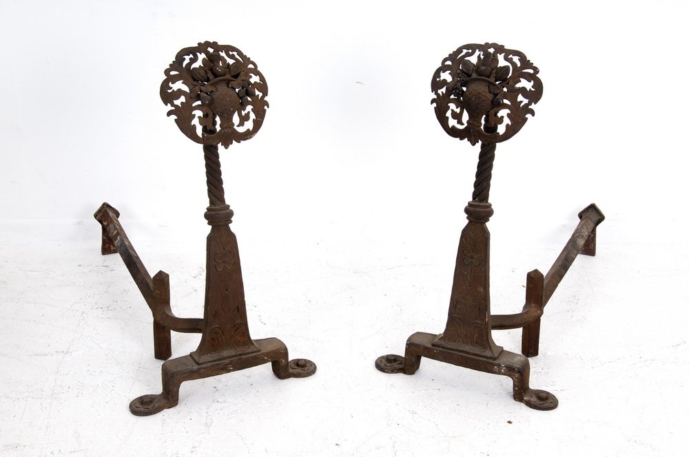 PAIR OF WROUGHT IRON ANDIRONS: each with a fruit filled basket terminal on foliate relief base Provenance: from the Estate of John Barrymore the Estate of James & Beverly Coburn, Beverly Hills 18 1/2 inches wide; 27 inches deep; 32