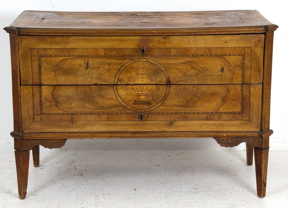 ITALIAN NEOCLASSICAL WALNUT MARQUETRY COMMODE: circa 1780 the rectangular top inlaid with a rectangular and checkered border around a four point compass rose and foliate swag; over two drawers inlaid sans travers with a rectangular border around a