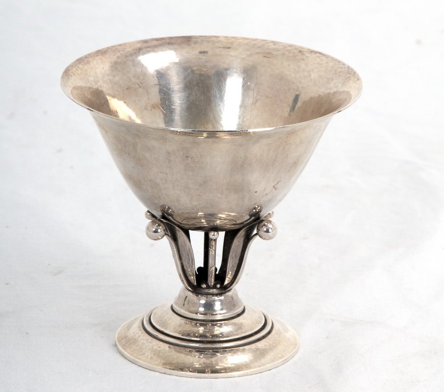 GEORG JENSEN STERLING COMPOTE: circa after 1945 the lightly hammered fluted bowl raised on a foliate and berry openwork stem, on a round stacked foot mark of Johan Rohde; pattern 17A 6 troy ounces 4 1/4 inches high