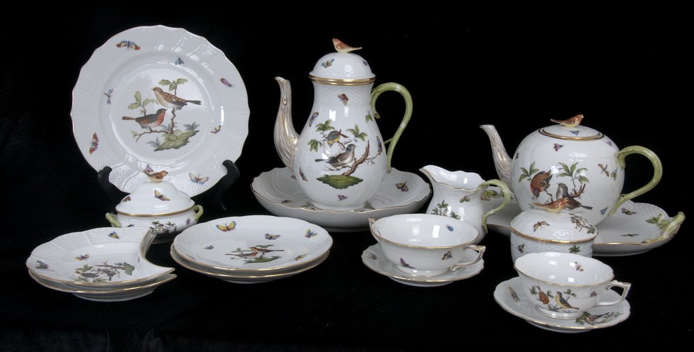 HEREND PORCELAIN PARTIAL DINNER SERVICE: Rothschild Bird pattern Comprising of a service for 12: 12 chargers; 12 dinner plates; 12 salad plates; 12 crescent salad plates; 12 cream soups and under plates; 11 breads; 10 cake plates; 12 teacups
