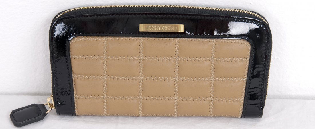 JIMMY CHOO NUDE & BLACK ZIP-AROUND WALLET: Quilted zippered wallet; authenticity card, cloth bag, and outer box 7 1/2 inches wide; 1 inch deep; 4 inches high
