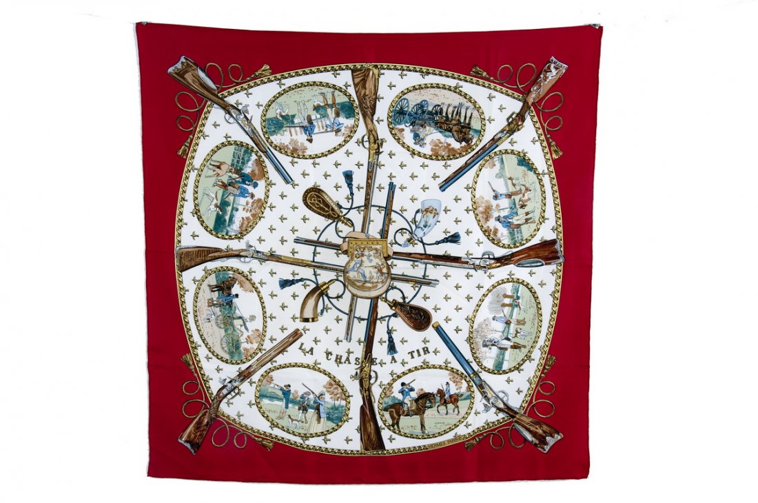 HERMES SILK SCARF "LA CHASSE A TIR": Designed by Philip Ledoux; eighteenth century shooting party theme with central image of rifles, powder kegs, and hunting items 35 inches x 35 inches