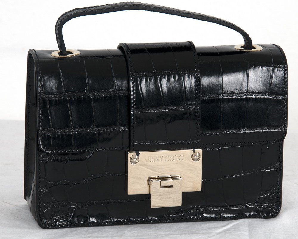 JIMMY CHOO BLACK "REBEL" HANDBAG: Faux crocodile black small purse with carry handle; detachable shoulder strap; silvertone hardware 8 inches wide; 2 1/2 inches deep; 6 inches high