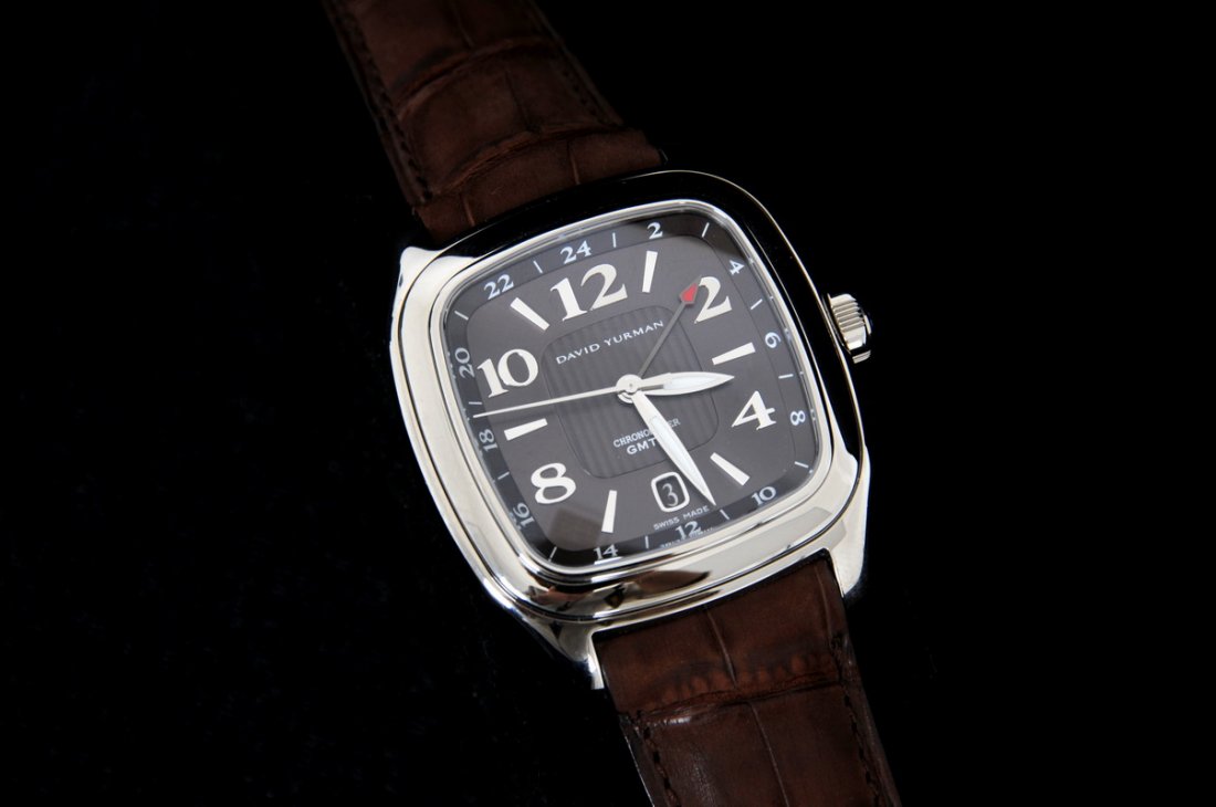 DAVID YURMAN GENTLEMEN'S WATCH: Stainless steel GMT Chronometer with chocolate dial, brown padded band; stainless buckle; box and papers Retail: $4200