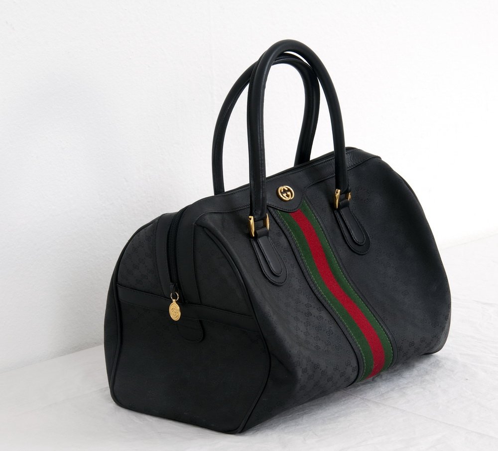 GUCCI CARRY-ON BAG: Boston style Vintage Gucci bag with central green and red stripe on black; zipper; lining removed 13 inches wide; 7 inches deep; 10 inches high