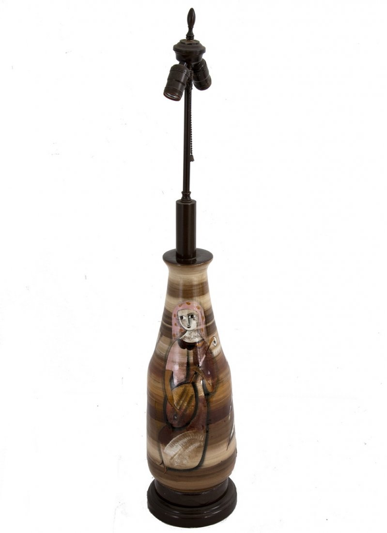 POLIA PILLIN CERAMIC TABLE LAMP: the figures on a brown glazed ground the vase measuring 20 inches high; 38 3/4 total inches high