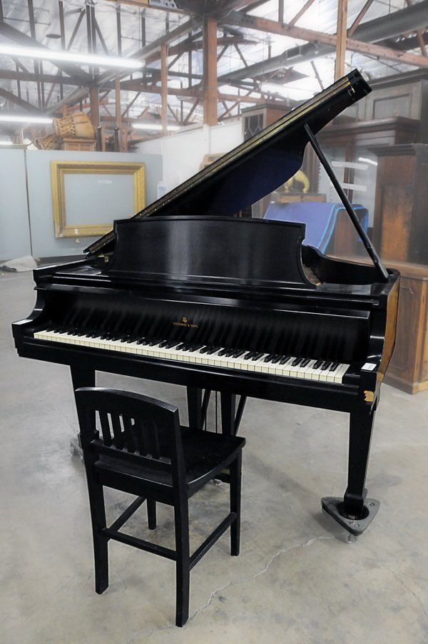 STEINWAY & SONS EBONY CASE GRAND PIANO: with chair; 1967-68; model "L"; serial number 401565 Provenance: The Estate of Bess Myerson Condition: with loss of veneer to front right of case 5' 10 3/4"
