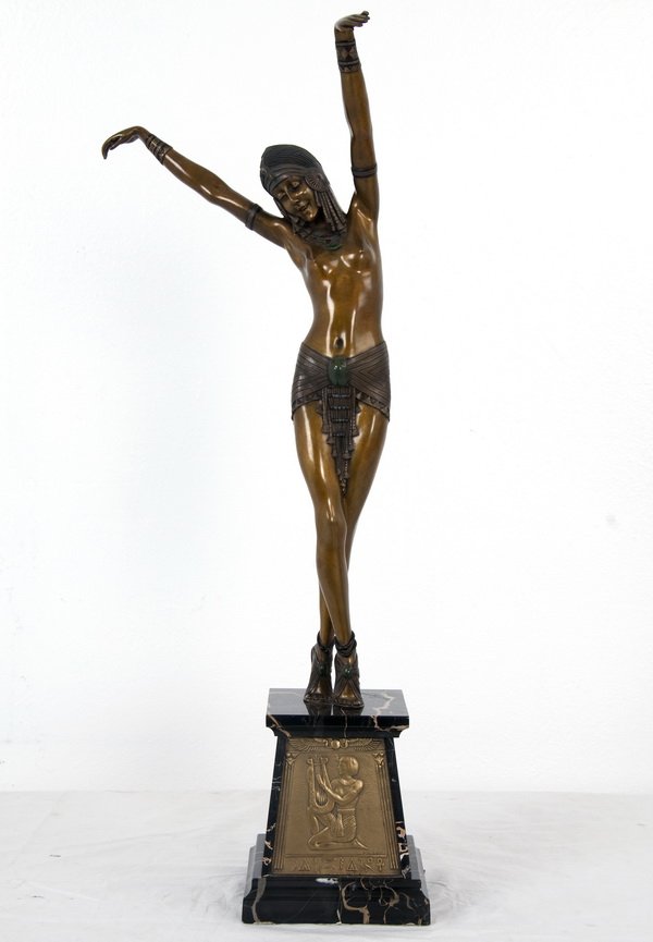 DEMETRE CHIPARUS: "EGYPTIAN DANCER": the cold painted bronze figure of a partially clad dancing woman on a square black marble base with frontal bronze Egyptian scene plaque; incised base 22 inches high; 28 1/2 total inches high