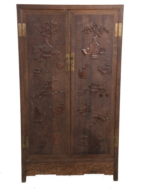 CHINESE HUANGHUALI TWO DOOR CHINESE CABINET: carved in low relief with flowering vases and brush pots 35 1/2 inches wide; 15 inches deep; 63 inches high