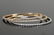 THREE 18 KARAT GOLD & DIAMOND BANGLE BRACELETS