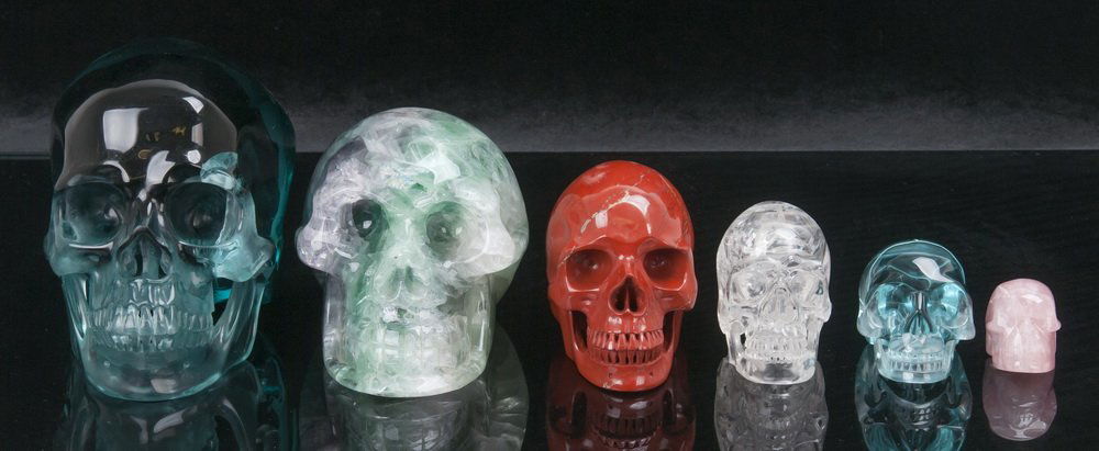 GROUP OF CARVED STONE HUMAN SKULLS (1 of 6)