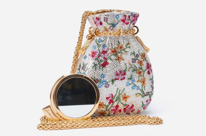 JUDITH LEIBER BEGGARS POUCH MINAUDIERE: a multicolor Swarovski crystal floral exterior over a gold leather interior; push button closure opens to hold a drop-in chain shoulder strap. 4 inches wide; 5 1/2 inches high