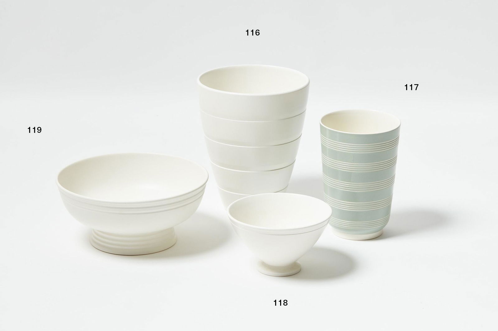 Keith Murray for Wedgwood: Keith Murray for Wedgwood Tapering cylindrical vase with sage green glaze and five lathe turned bands stamped KM mark to the base H. 200mm Provenance: Damian Balle Collection