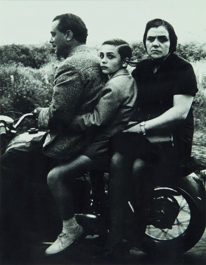 William Klein, Holy Family on Moto, Rome: gelatin silver print, 1956 (printed 1977) title inscribed, signed and dated and inscribed 1977 verso 350 x 280mm