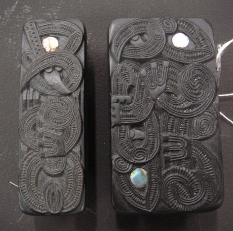 Maori folk art clothes brush and shoe brush: each carved with a manaia in low relief
