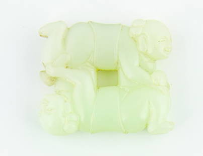 A pale celadon jade carving: depicting the two Immortals boys He Erxian playing with a ruyi scepter. L. 50mm Provenance: From the Leo Walker Tattersfield Collection of Chinese Jades