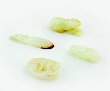 Four small pale celadon jade animal carvings: including a rabbit, a mouse, a dog and a cat group The first, L. 35mm Provenance: From the Leo Walker Tattersfield Collection of Chinese Jades