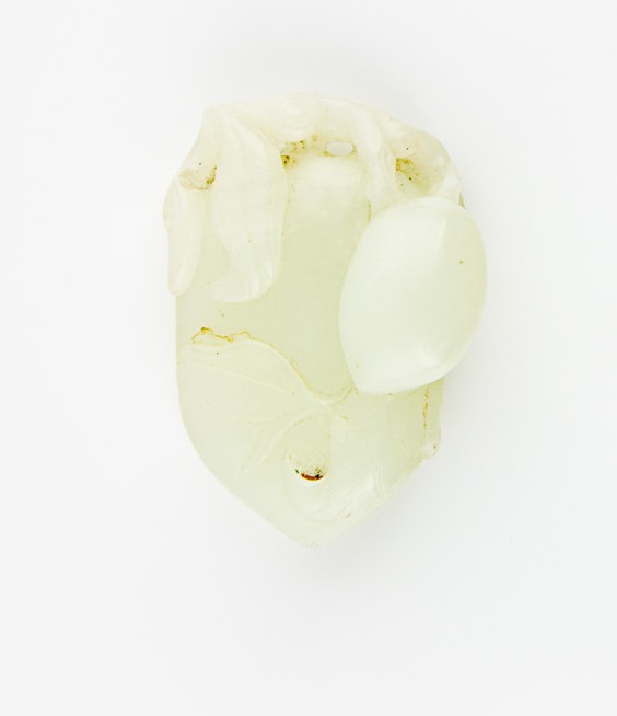 A pale celadon jade pendant of peaches and leaves: H. 50mm Provenance: From the Leo Walker Tattersfield Collection of Chinese Jades