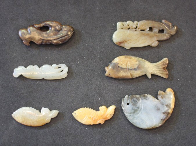 Seven various jade and jadeite fish pendants: The largest, L. 63mm Provenance: From the Leo Walker Tattersfield Collection of Chinese Jades