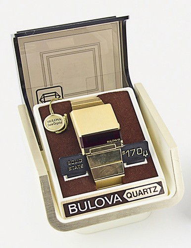 Bulova Accutron: Computron Driver Watch 1977. A trapezoid watch case with red Plexiglas crystal, 14kt gold electroplated. This is a rare and complete example for the discerning collector. New, old stock with original