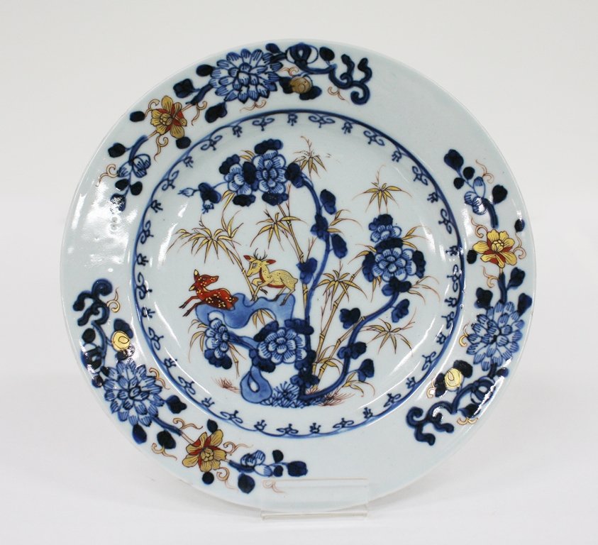 Early 18th century Chinese export imari dish: painted and gilt with deer amongst bamboo and peony sprays. D. 230mm