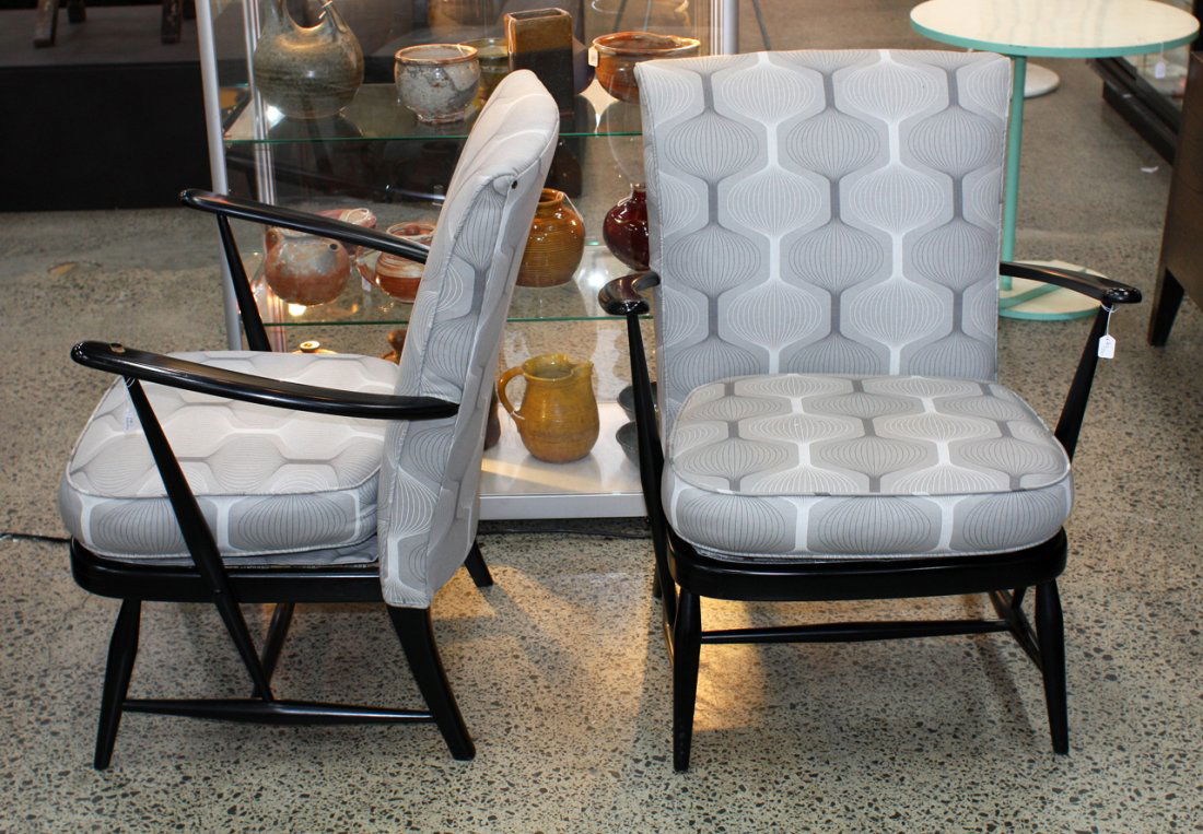 Lucian Ercolani for Ercol England: Pair of black lacquered lounge chairs upholstered in a 1960s style space age fabric.