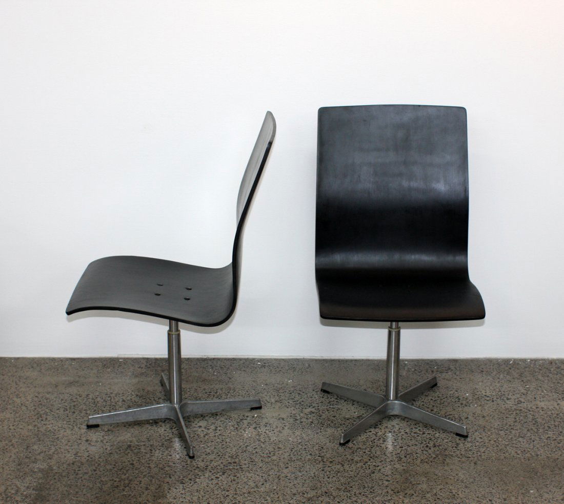 Arne Vodder for Fritz Hansen: Rare pair of Oxford chairs, laminated ebonised beech with steel frame. Fritz Hansen maker's labels affixed, circa 1963