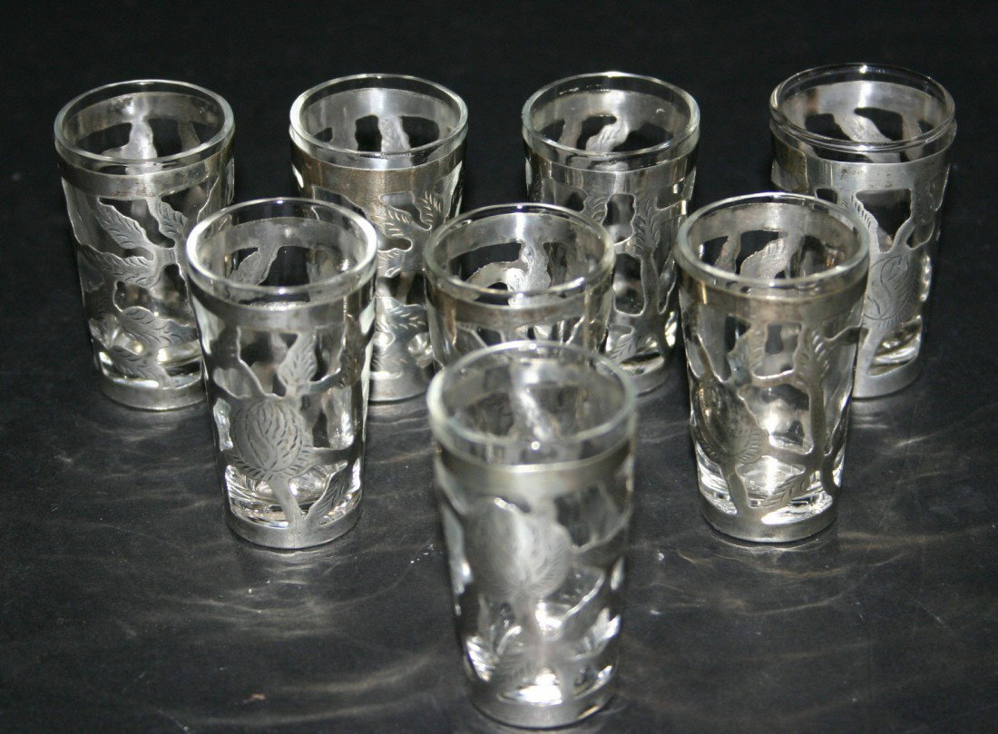 Eight (8) Sterling rose shot glass holders with gl: Eight (8) Sterling rose shot glass holders with glass inserts. 2"H. Sterling 4 grams.