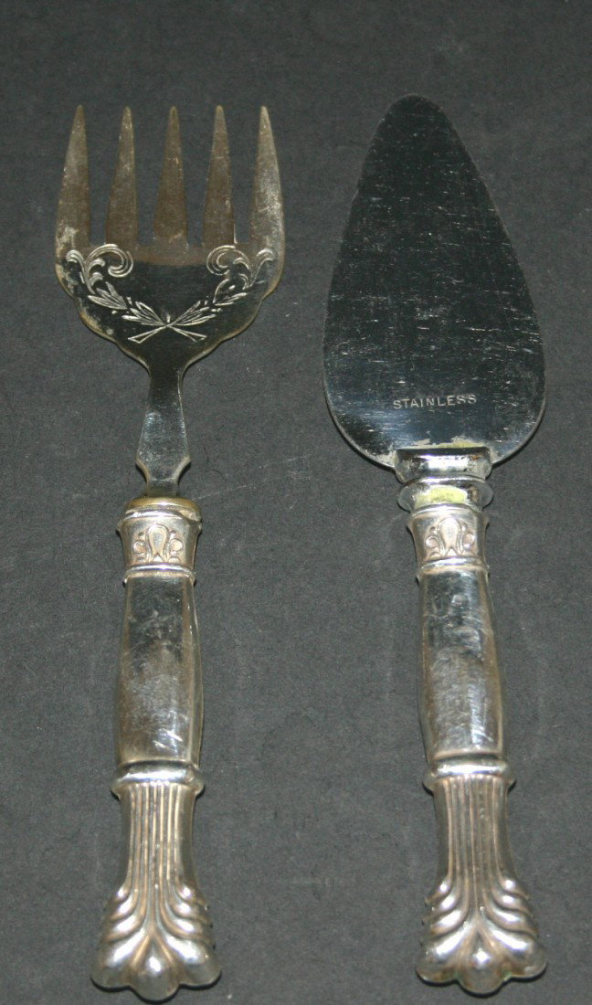 Sterling handled pie server with stainless blade. : Sterling handled pie server with stainless blade. 6 1/2"L. Sterling handled serving fork. 6"L. 7.5 grams.
