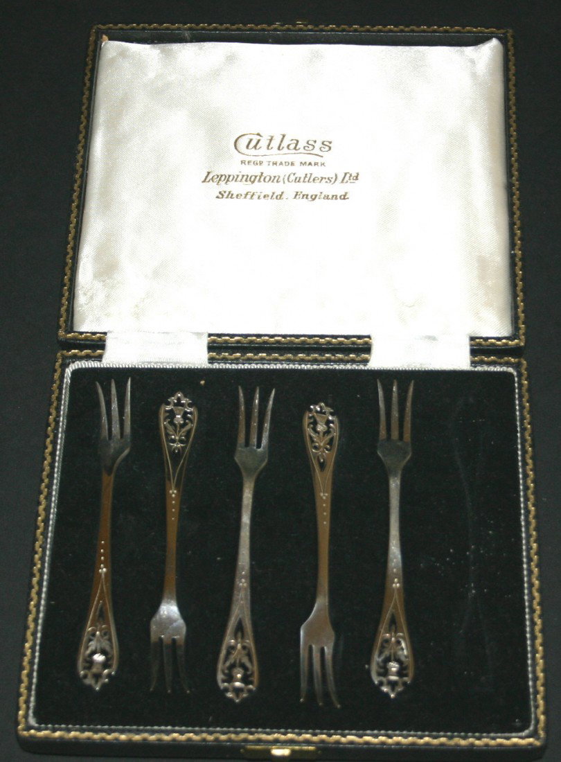 Five (5) Cutlass sterling hors d'oeuvre forks in b: Five (5) Cutlass sterling hors d'oeuvre forks in box marked Sheffield England. 4" long. 4 grams.