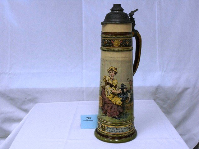 METTLACH STEIN, (DAMAGED TO HANDLE, SPIDER CRACKS : METTLACH STEIN, (DAMAGED TO HANDLE, SPIDER CRACKS ON BASE), 6.5 X 18.5IN.