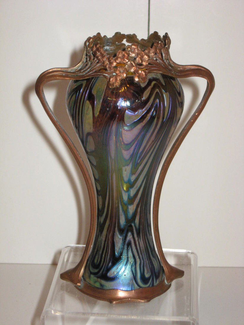 Loetz Art Nouveau vase: Loetz Art nouveau vase - irridescent vase in a King Tut design with Art Nouveau copper handles in the form of flowers. 6 1/2" tall.Good cond.