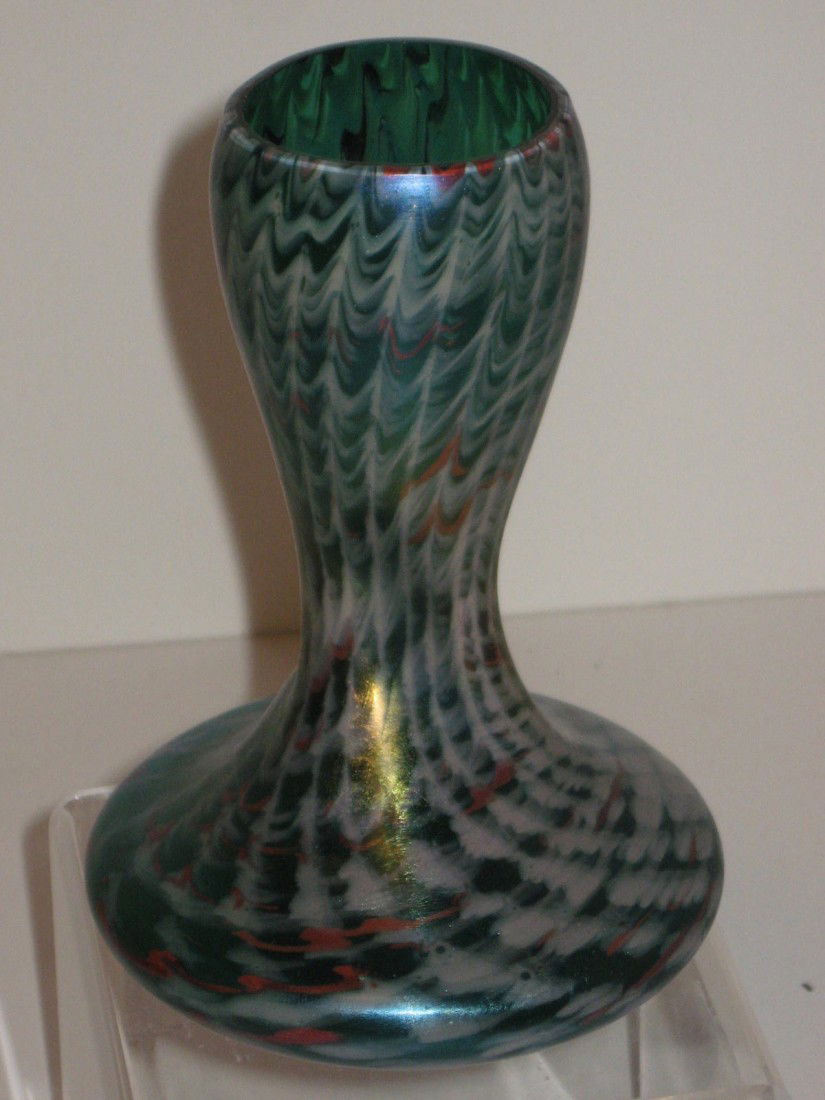 Loetz art glass vase: Loetz art glass vase - corset stick form in green glass decorated with a red and white zipper design. 5 1/2" tall, good condition.