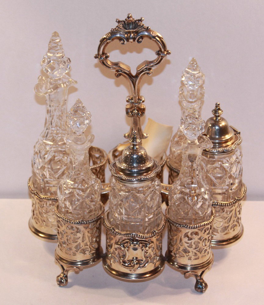 Marshall Fields Purchased Antique 1885 Silver Plat: Marshall Fields Purchased Antique 1885 Silver Plate Cruet Set. 6 bottles with chips to several.