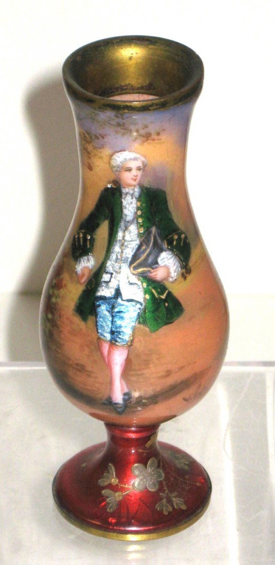 French enamel on copper vase,: footed urn form in various shades of red decorated with a Continental gentleman in a green coat, artists signed, 4 1/2" ht.