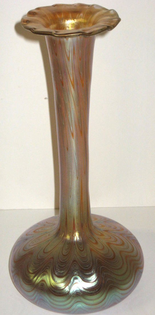 Loetz iridescent glass vase,: bulbous stick form with a spreading and ruffled rim decorated with undulating bands of iridescence, signed Loetz Austria, 11 1/2" ht.